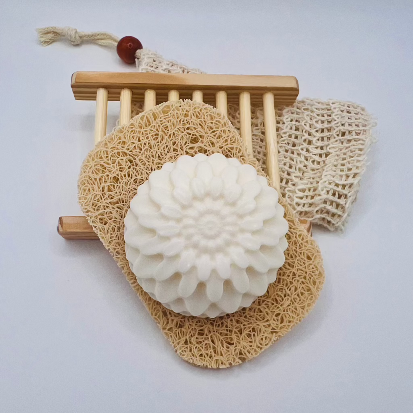 A melt & pour soap with exfoliating bag and soap dish.