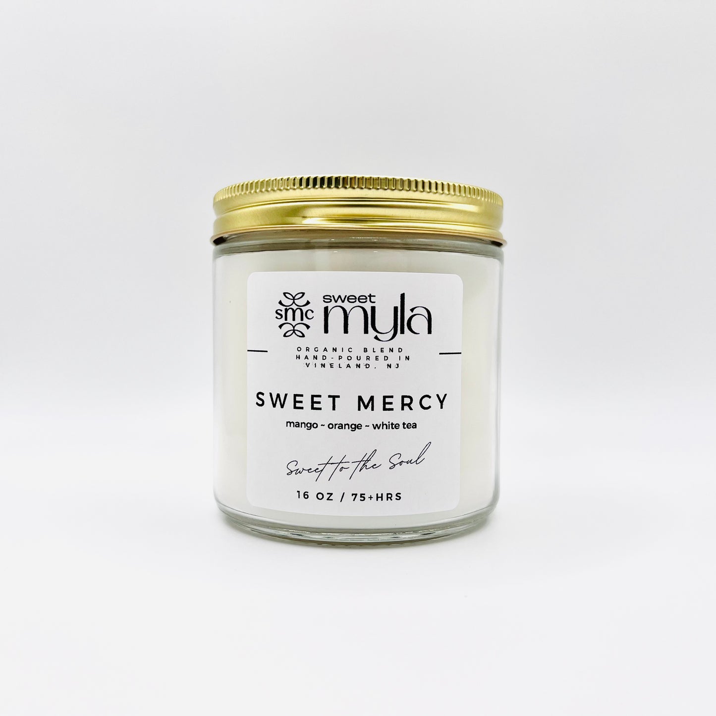 Sweet Mercy Candle with fragrance notes of Mango, Orange & White Tea