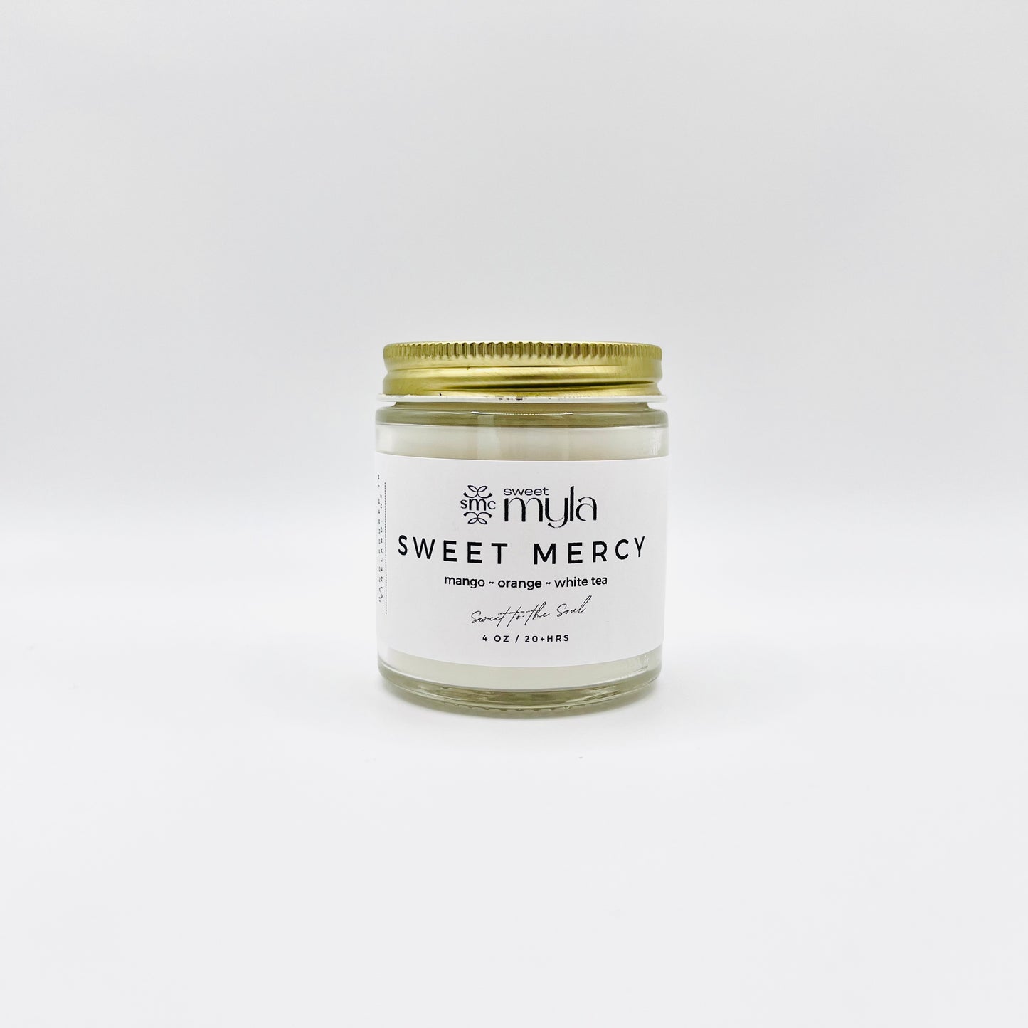 Sweet Mercy Candle with fragrance notes of Mango, Orange & White Tea