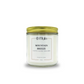 Candle jar labeled 'Mountain Breeze' with a gold lid on a white background