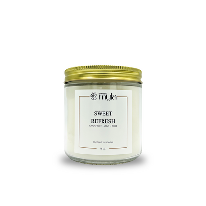 Candle jar labeled 'Sweet Refresh' by Sweet Myla on a white background