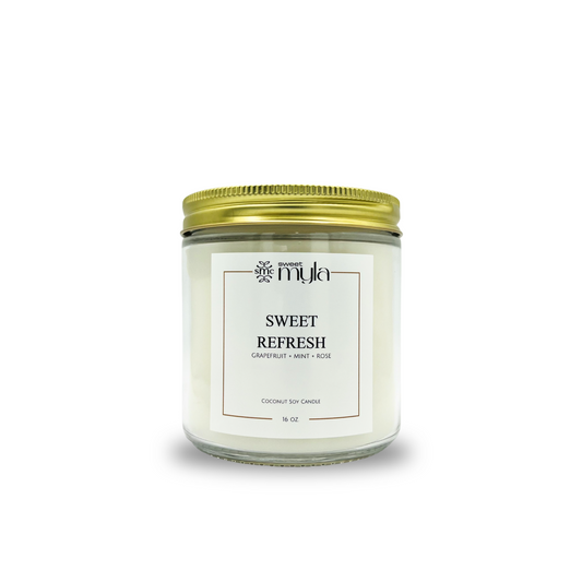 Candle jar labeled 'Sweet Refresh' by Sweet Myla on a white background