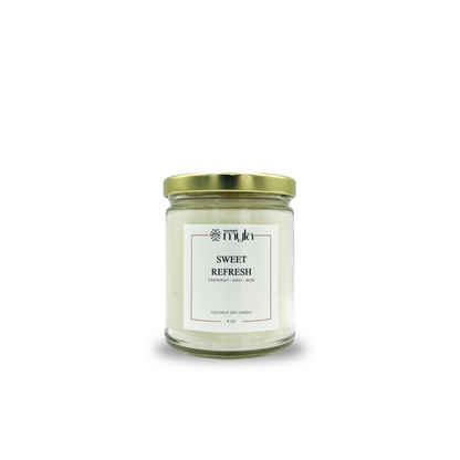 Candle jar labeled 'Sweet Refresh' by Sweet Myla on a white background
