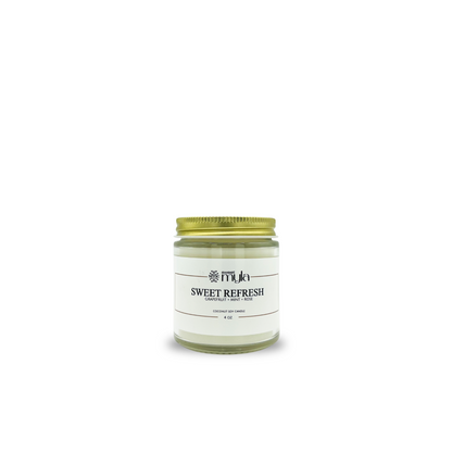 Candle jar labeled 'Sweet Refresh' by Sweet Myla on a white background