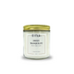 Candle jar labeled 'Sweet Tranquility' with a gold lid on a white background