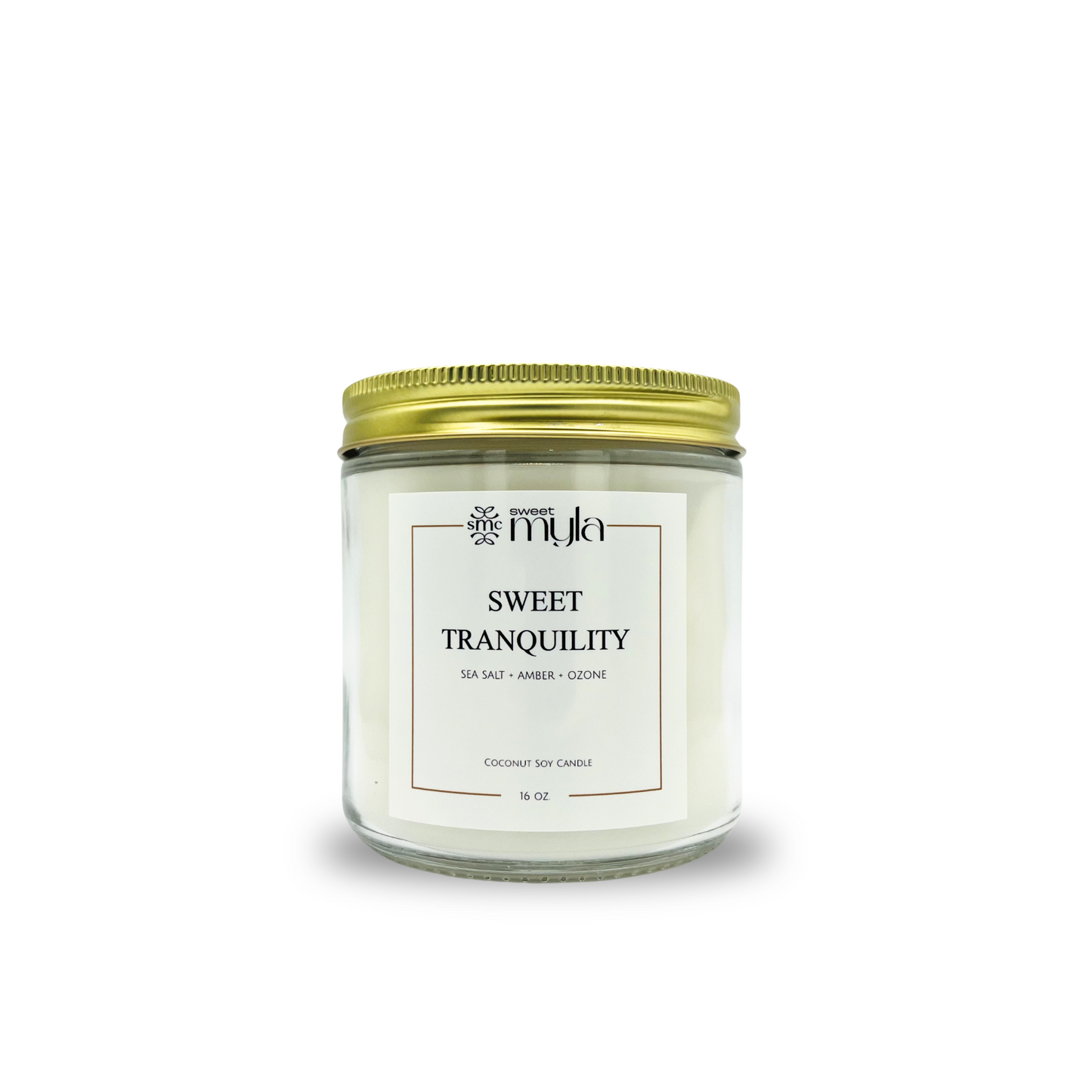 Candle jar labeled 'Sweet Tranquility' with a gold lid on a white background
