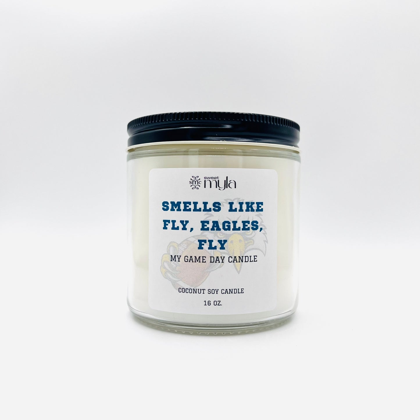 Candle with label that says Smells like a Fly, Eagles, Fly