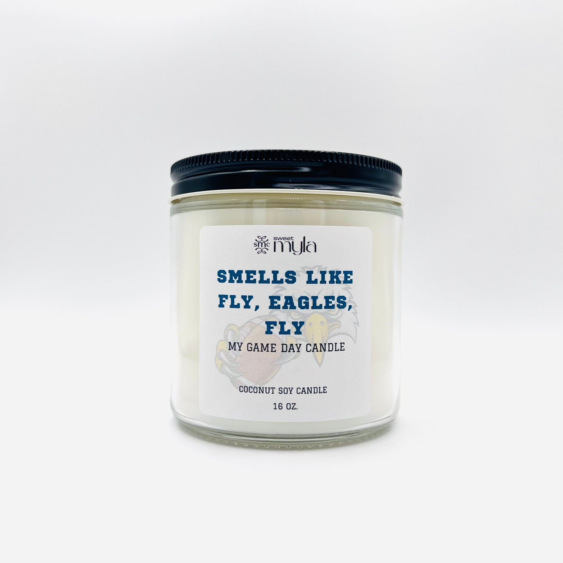 Candle with label that says Smells like a Fly, Eagles, Fly