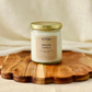 8oz. candle labeled 'Timeless Vanilla'