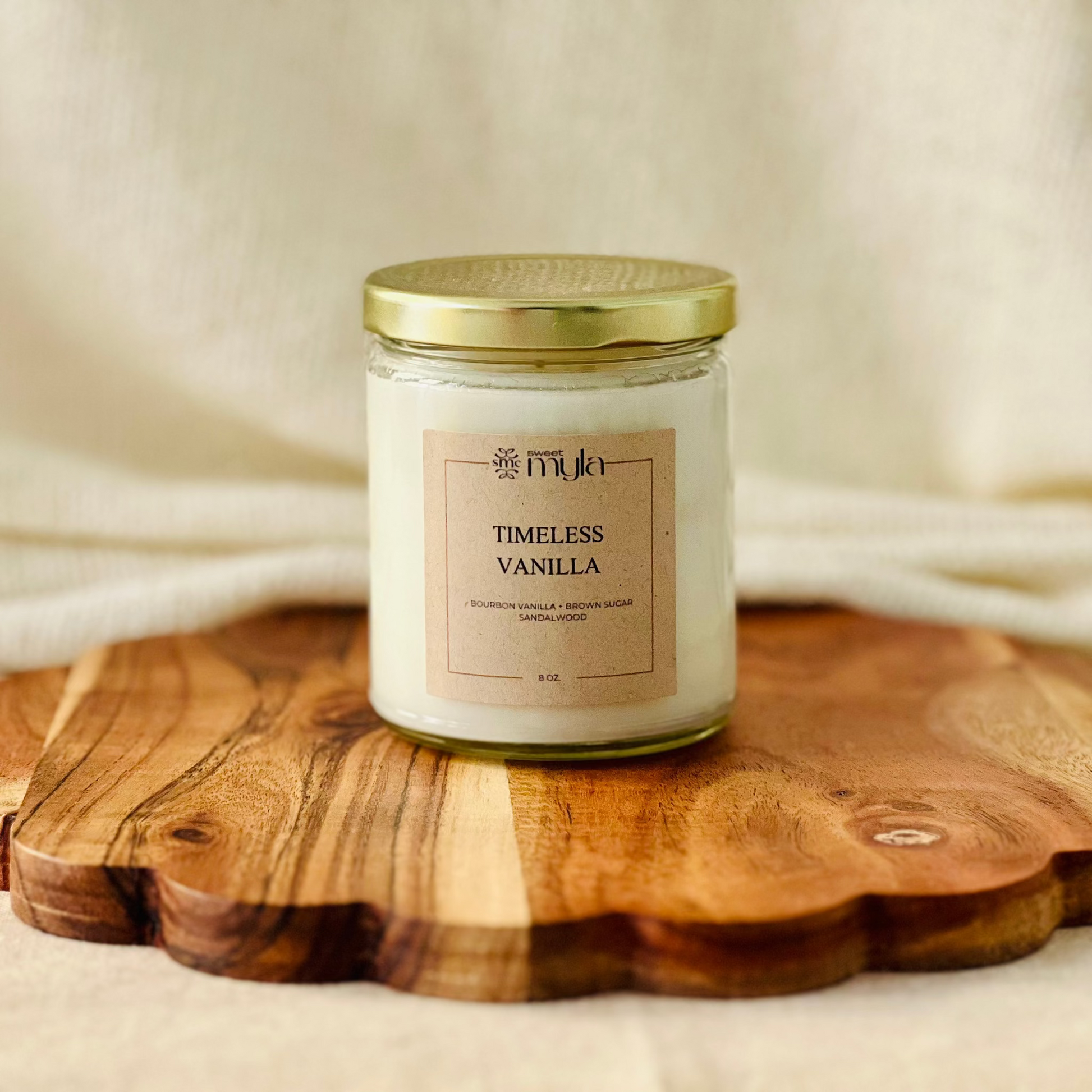 8oz. candle labeled 'Timeless Vanilla'