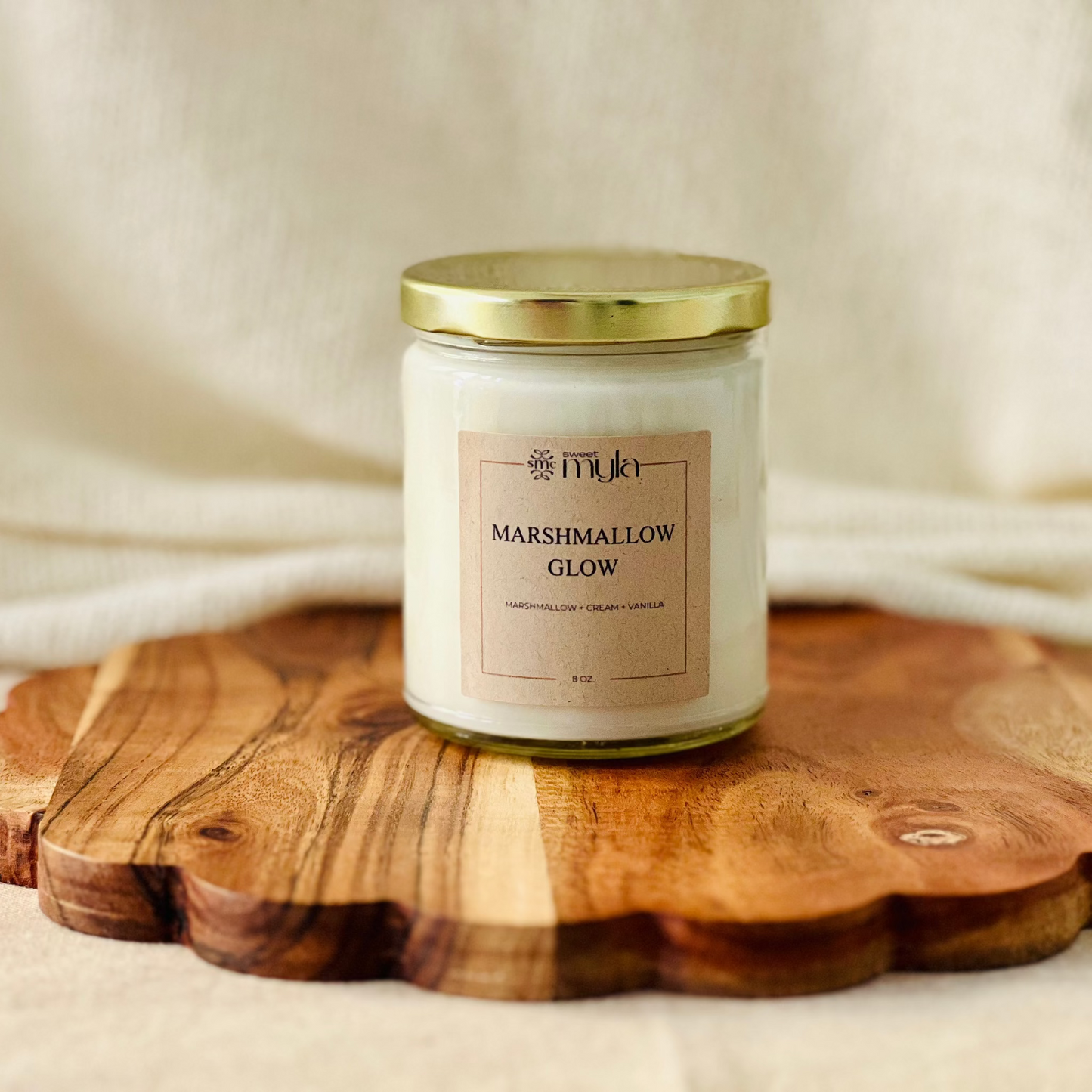 8oz. candle labeled 'Marshmallow Glow'