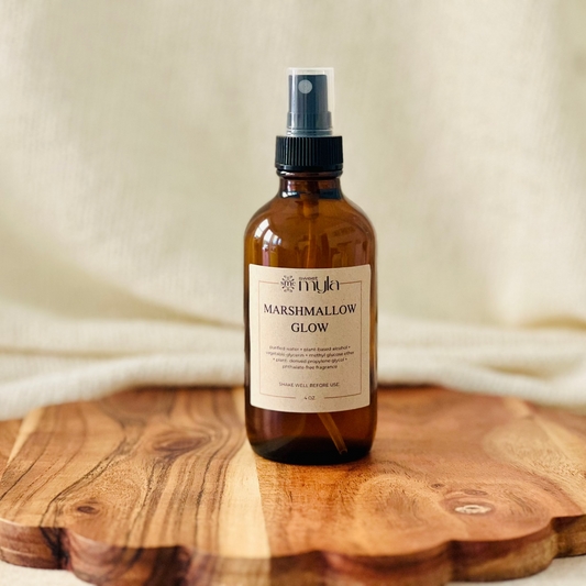Amber spray room and linen bottle with a label that read Marshmallow Glow. 