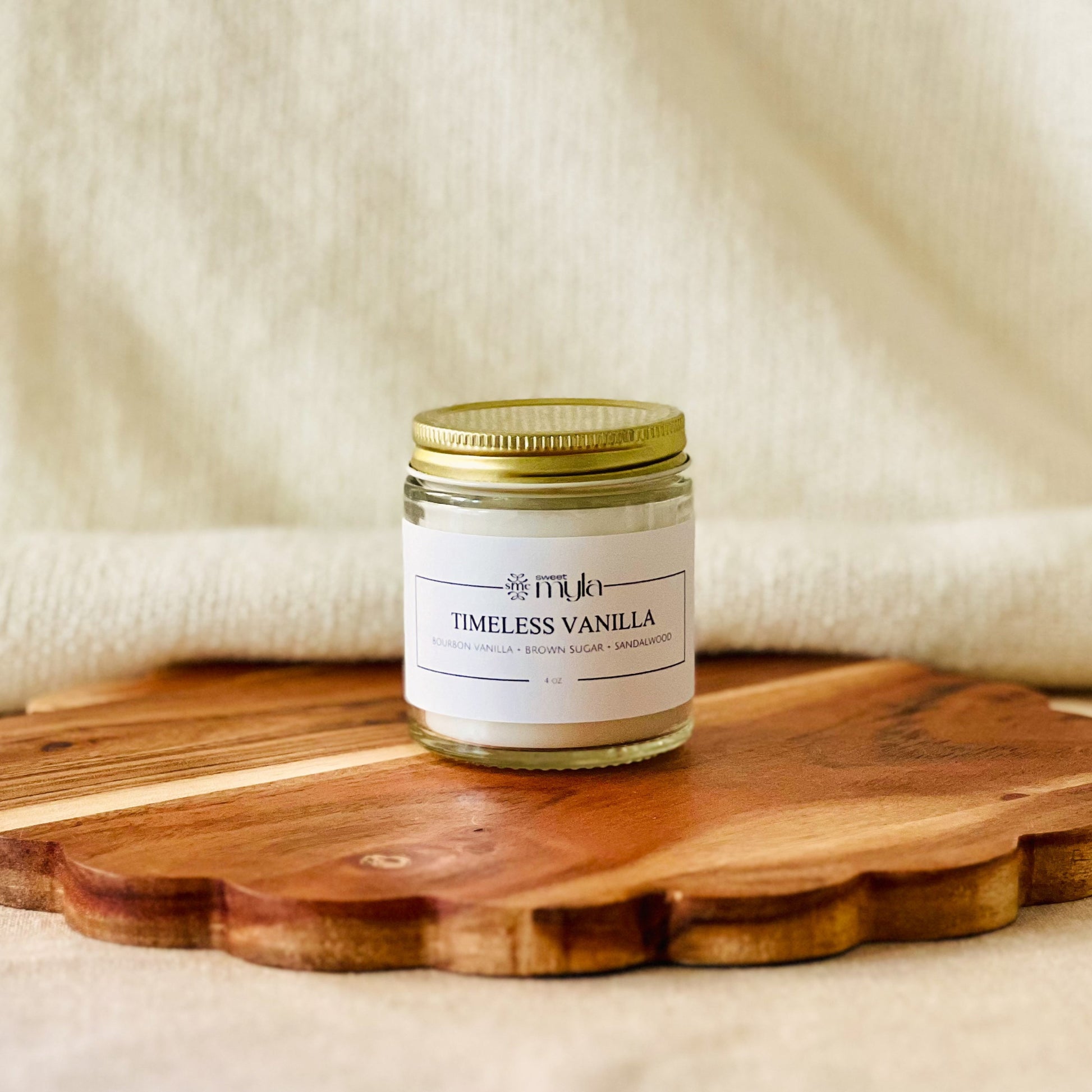 4oz. candle jar labeled 'Timeless Vanilla' 