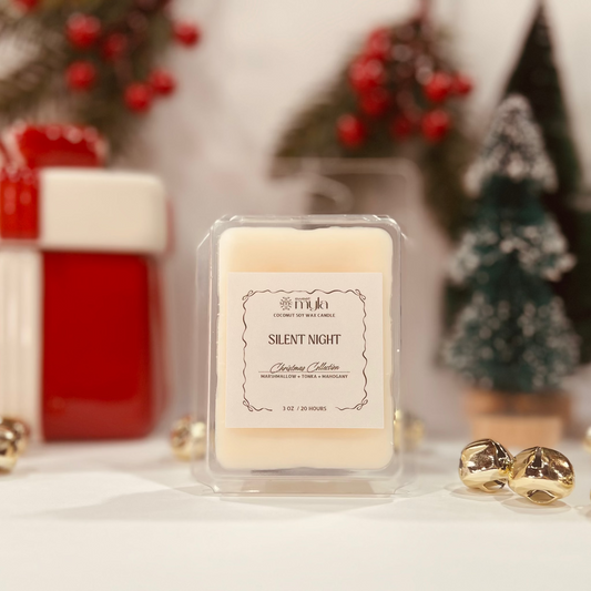 Wax melt labeled 'Silent Night' with Christmas decor in the  background