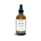 Brown room + linen spray bottle labeled 'Sweet Pear' on a white background