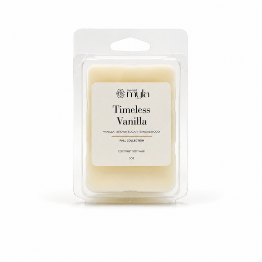 A packaged wax melt in a clear plastic clamshell package with a white label reading 'Timeless Vanilla' by Sweet Myla. 