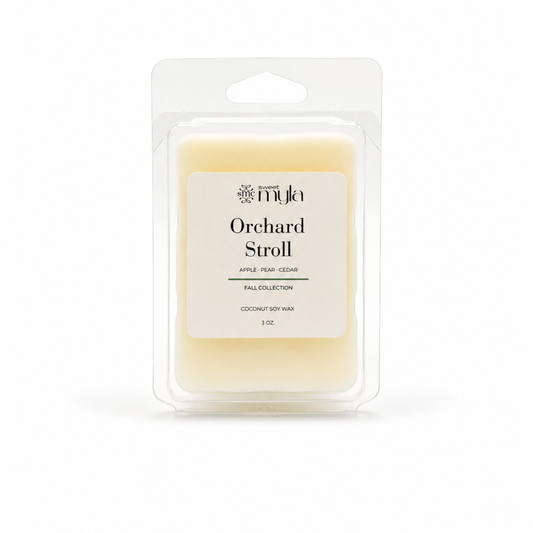 Wax melt in clamp shell with a cream label the says Orchard Stroll by Sweet Myla. 