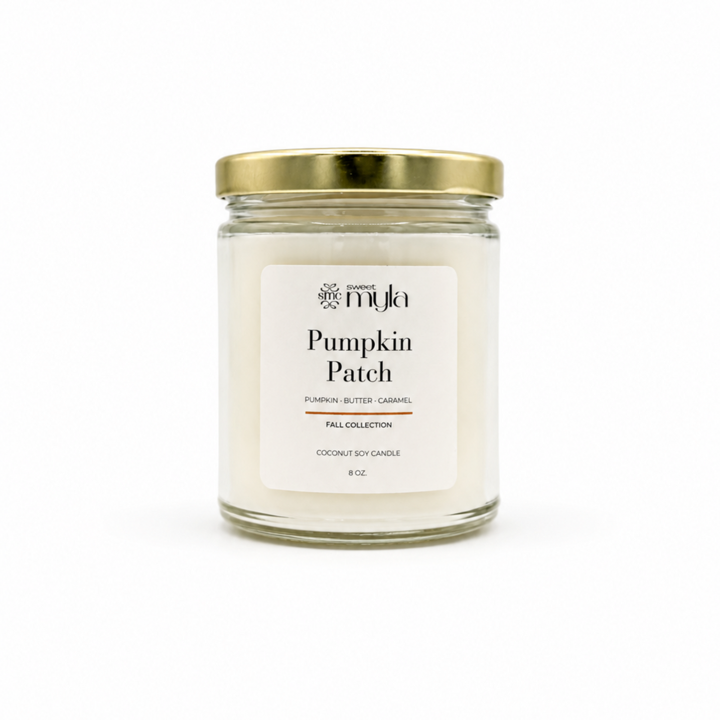 A 8 oz soy candle in a clear glass jar with a white label and a gold metal lid, labeled 'Pumpkin Patch' by the brand Sweet Myla