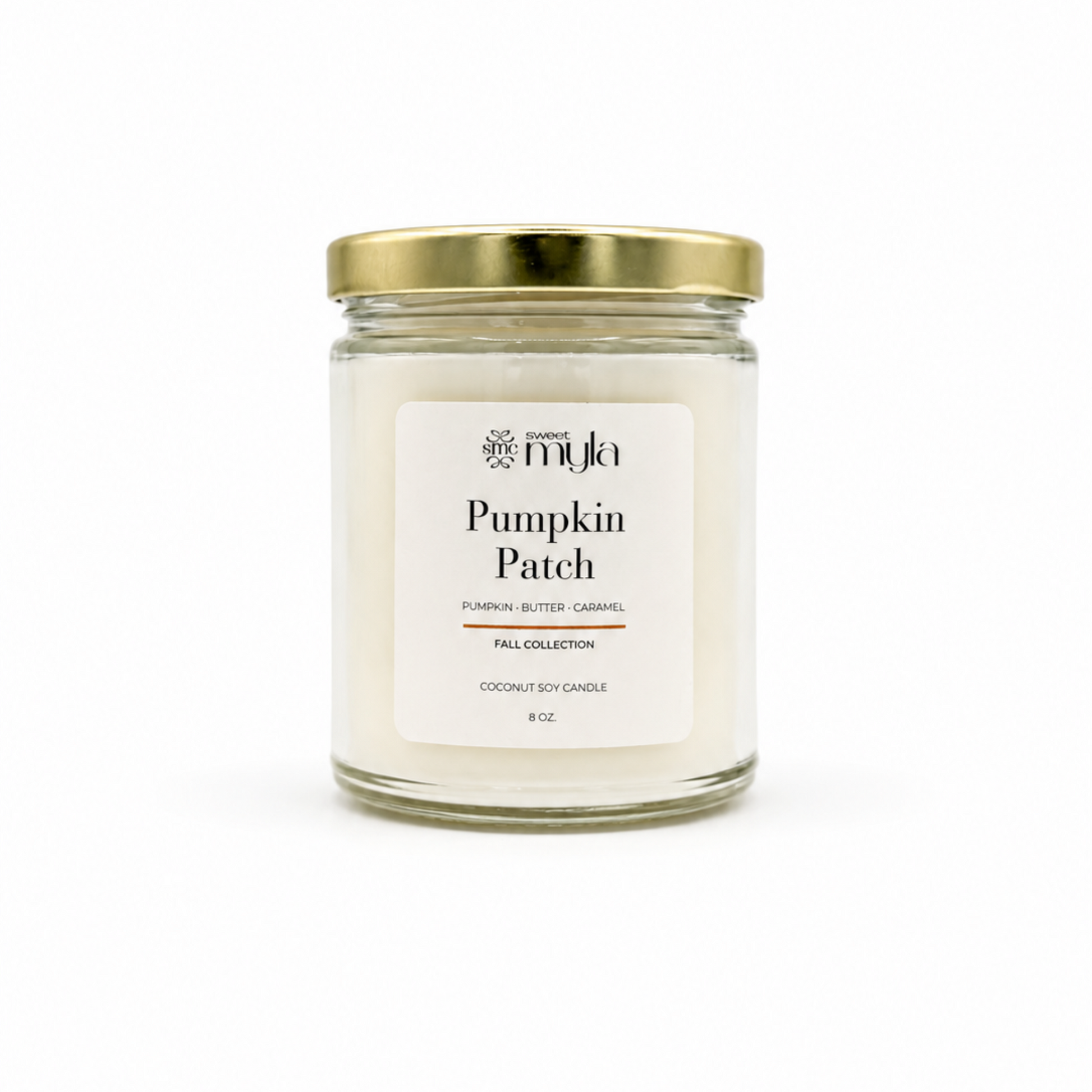 A 8 oz soy candle in a clear glass jar with a white label and a gold metal lid, labeled 'Pumpkin Patch' by the brand Sweet Myla