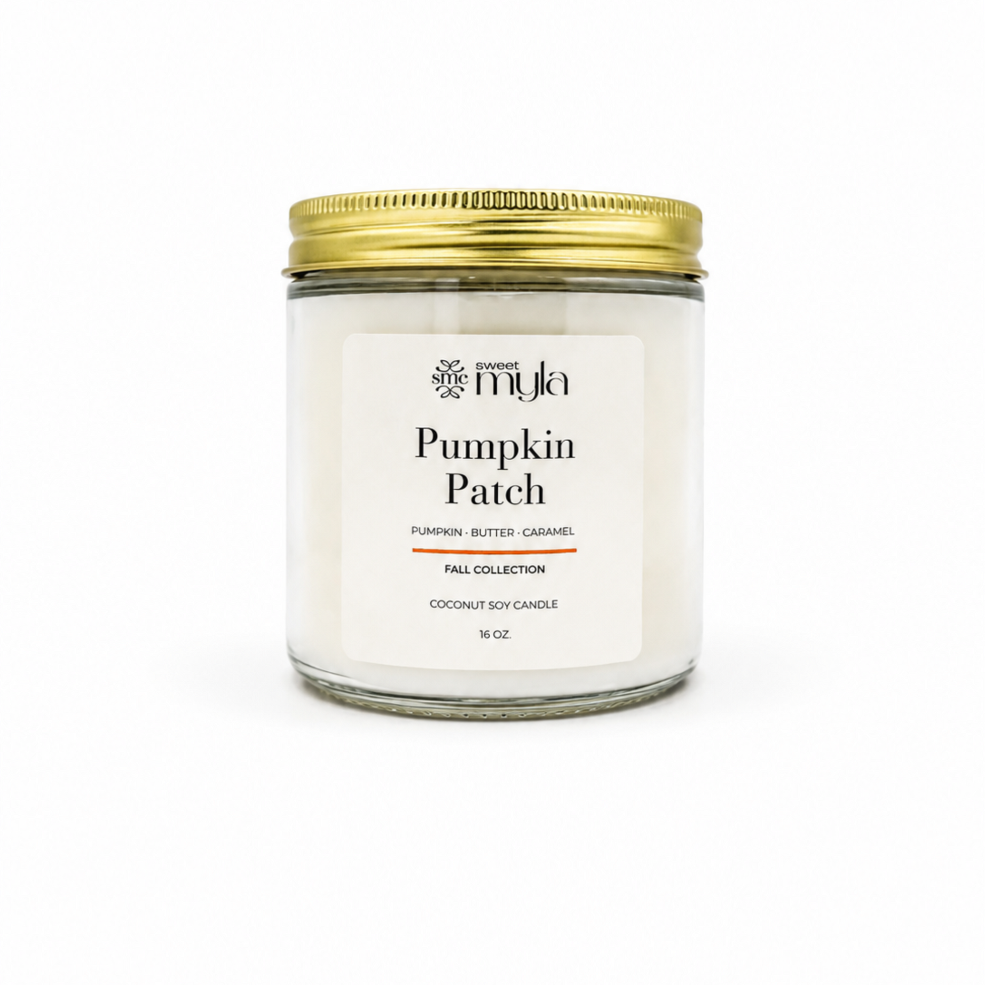 A 16 oz soy candle in a clear glass jar with a white label and a gold metal lid, labeled 'Pumpkin Patch' by the brand Sweet Myla