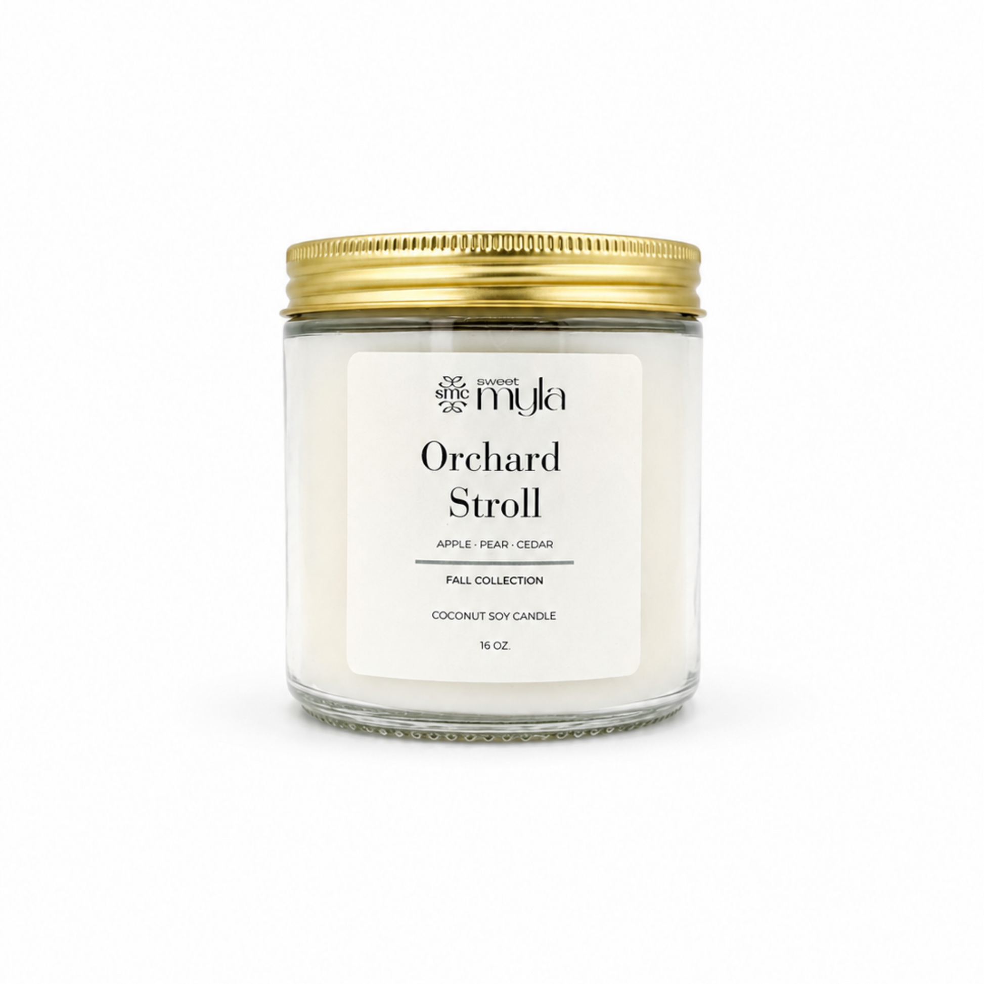 A 16 oz soy candle in a clear glass jar with a white label and a gold metal lid, labeled 'Orchard Stroll' by the brand Sweet Myla