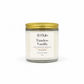 A 8 oz coconut soy candle in a clear glass jar with a white label reading 'Timeless Vanilla' by the brand 'Sweet Myla', topped with a metallic gold screw-on lid, set against a plain white background.