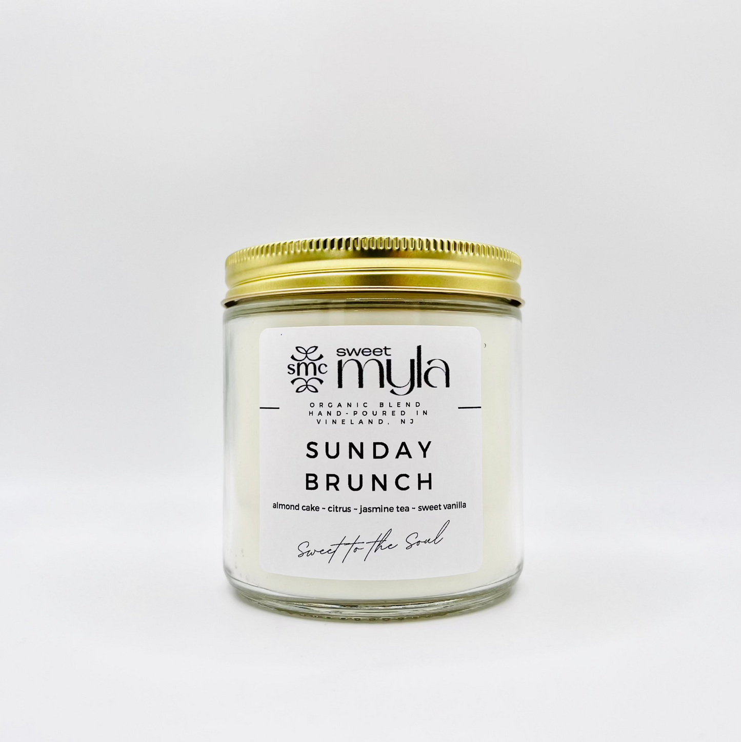 Sunday Brunch Candle with almond cake, citrus, jasmine tea, and sweet vanilla scent.