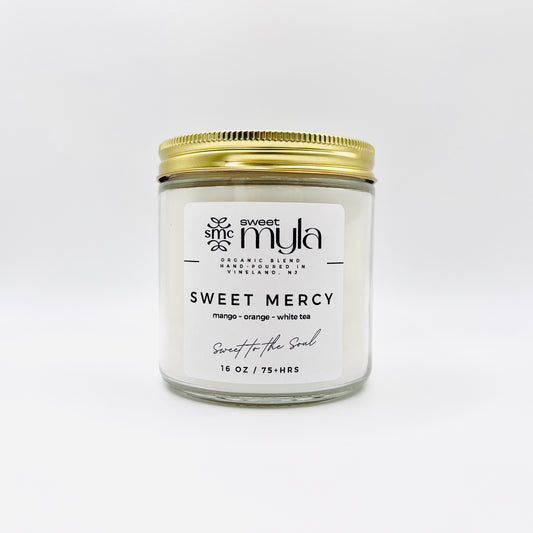 Sweet Mercy Candle with fragrance notes of Mango, Orange & White Tea