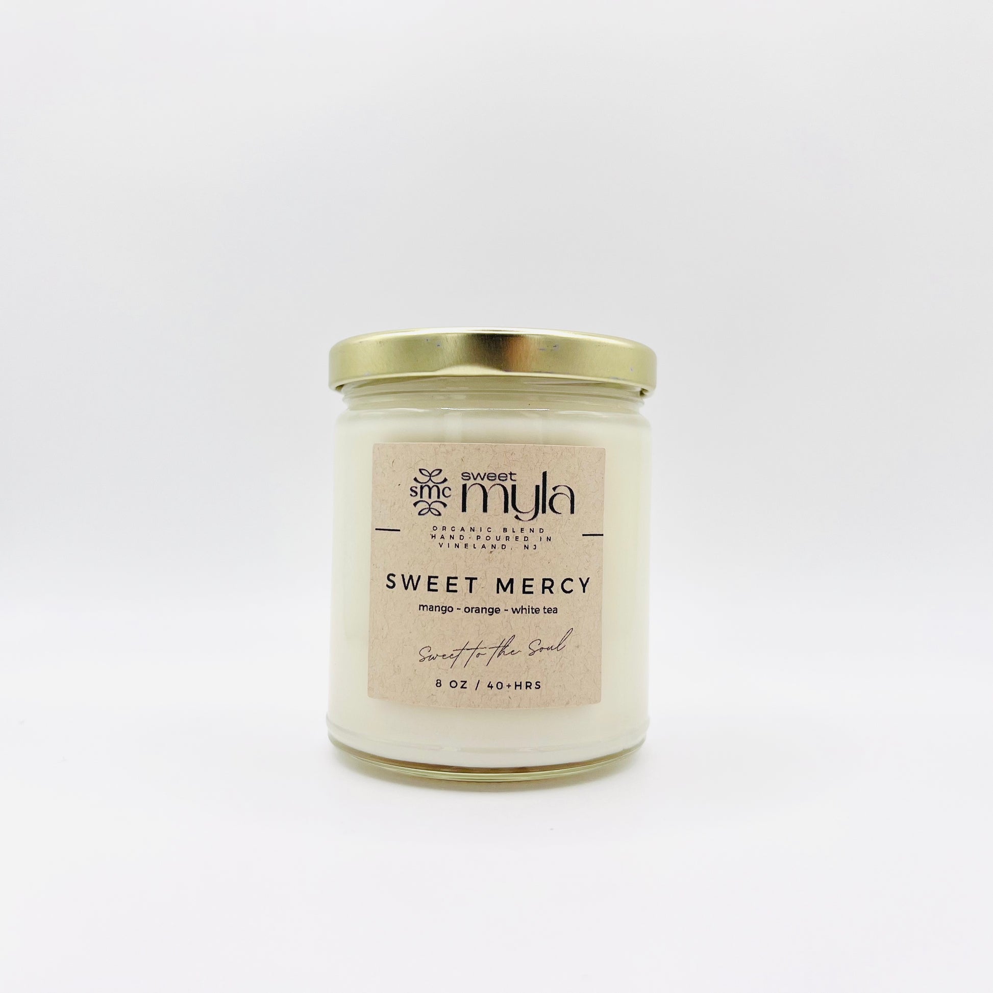 Sweet Mercy Candle with fragrance notes of Mango, Orange & White Tea